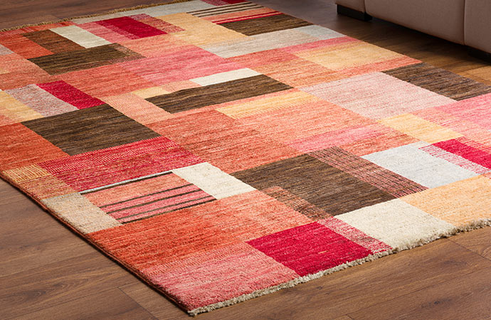 Multi color rug on wooden floor